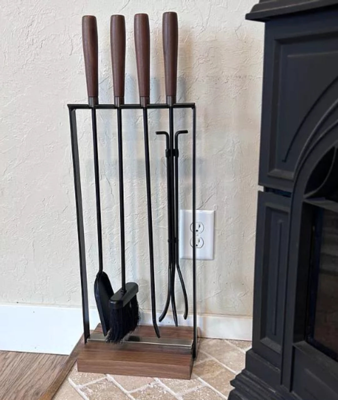 customer image of Modern Ember contemporary fireplace tools with tapered wooden grips, matte black shafts, and open-frame vertical holder