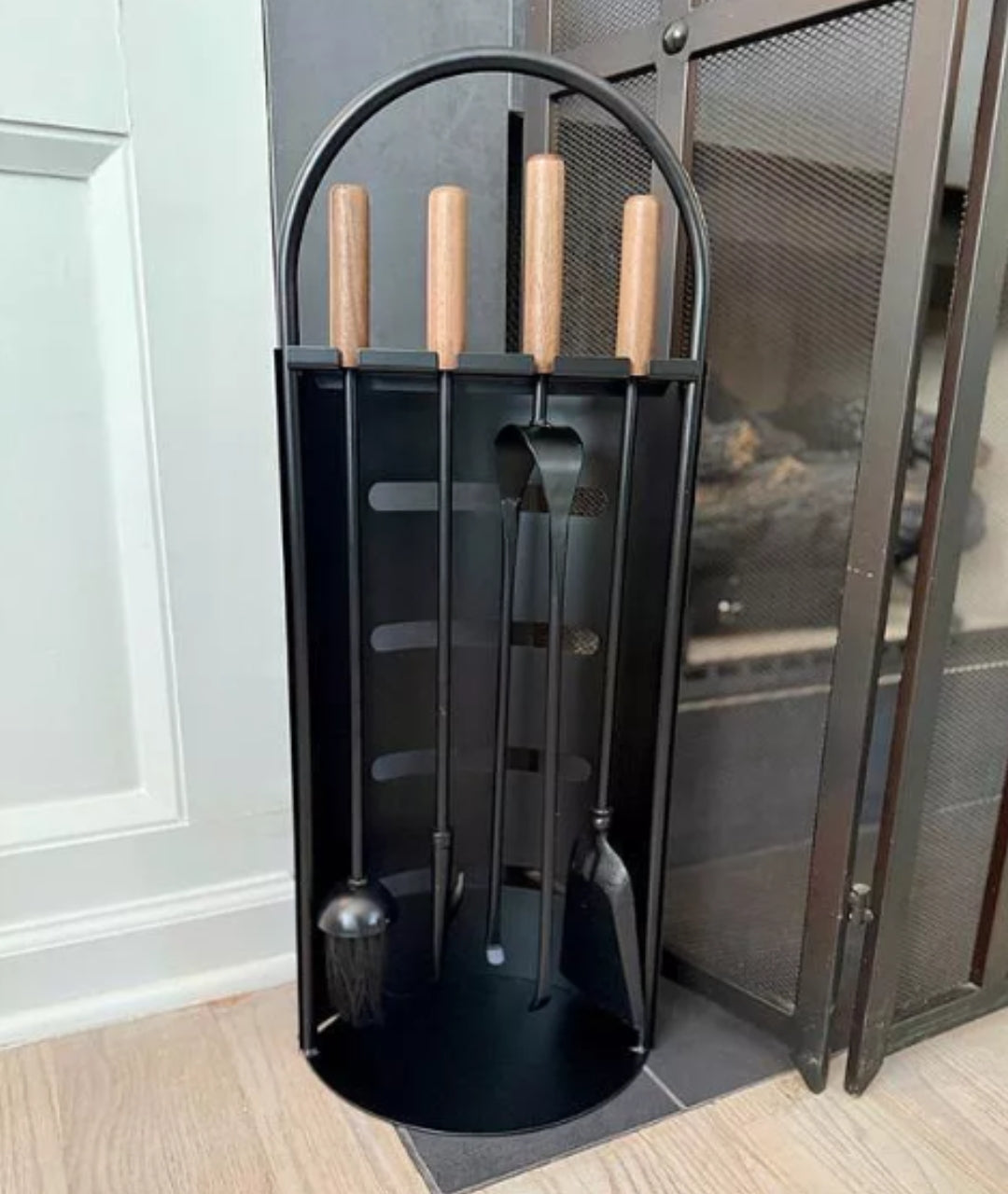 customer image of compact matte black fireplace tool stand with shovel, poker, tongs, and brush with rounded wood grips by Modern Ember.