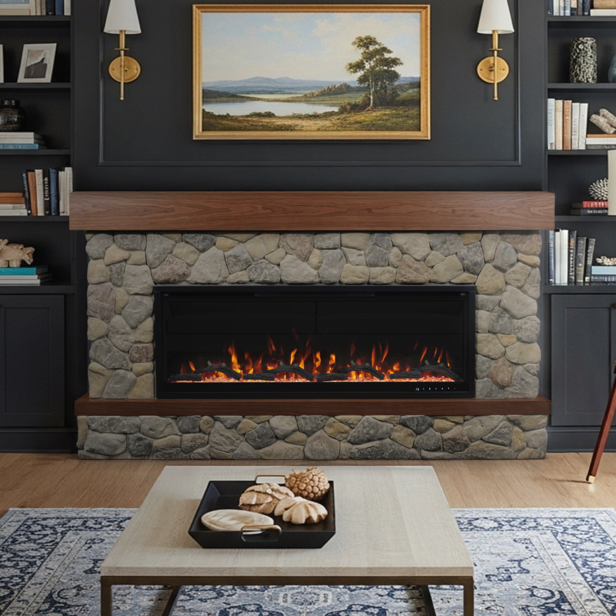 Brookstone River Rock Mantel with  50” Aerus smart fireplace insert framed by rustic cast stone and walnut mantel shelf, styled in a traditional living room with wall art.