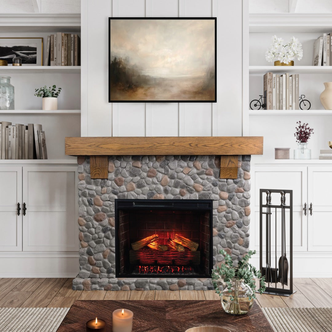 Close up of the Glenbrook River Rock Mantel with a white oak shelf and cast stone river rock surround, featuring a 28" smart electric firebox insert. Rustic farmhouse living room decor.