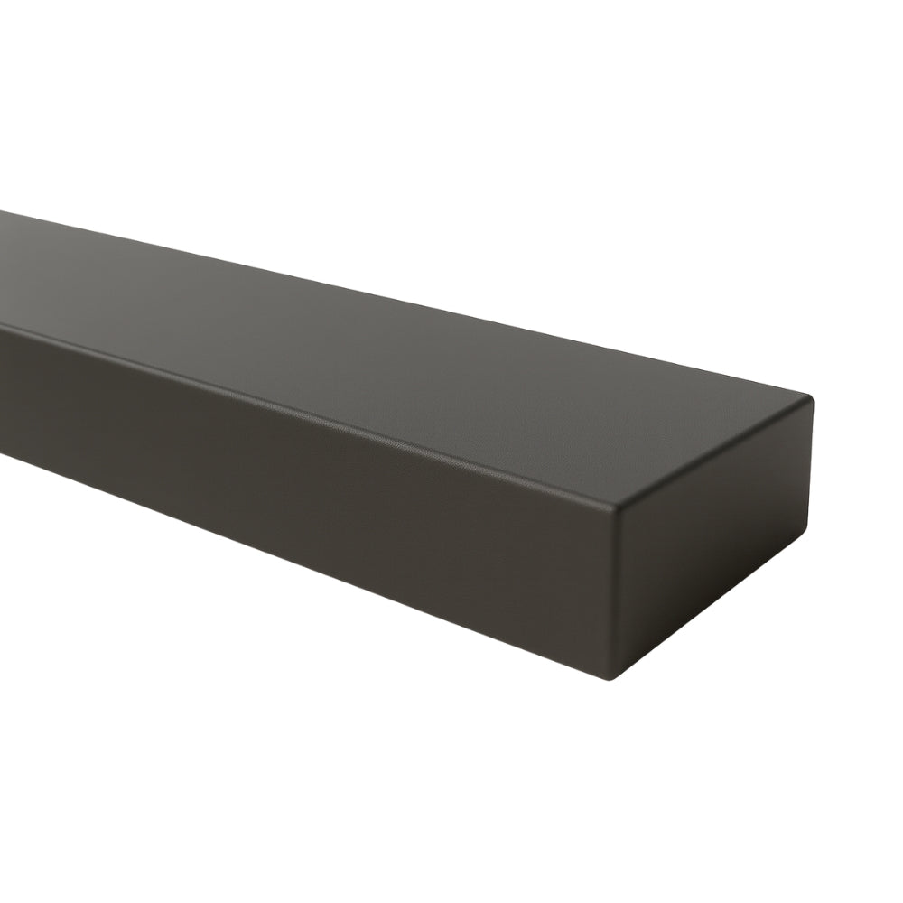 Close-up of a Lustra Metal floating shelf in a sleek flint finish, highlighting the smooth, reflective texture and precise corners.