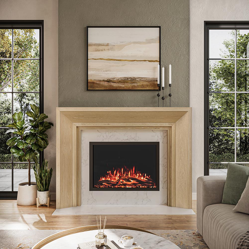 Everly Mantel Surround in whitewash finish installed around an electric fireplace in a living room, complementing a clean, modern aesthetic.