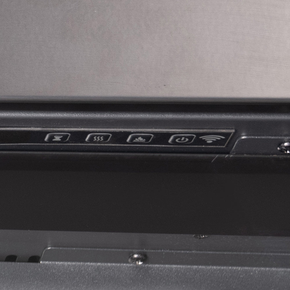 Close-up of the top edge of the Highmark Traditional Fireplace insert, showing the internal vent and simple trim.