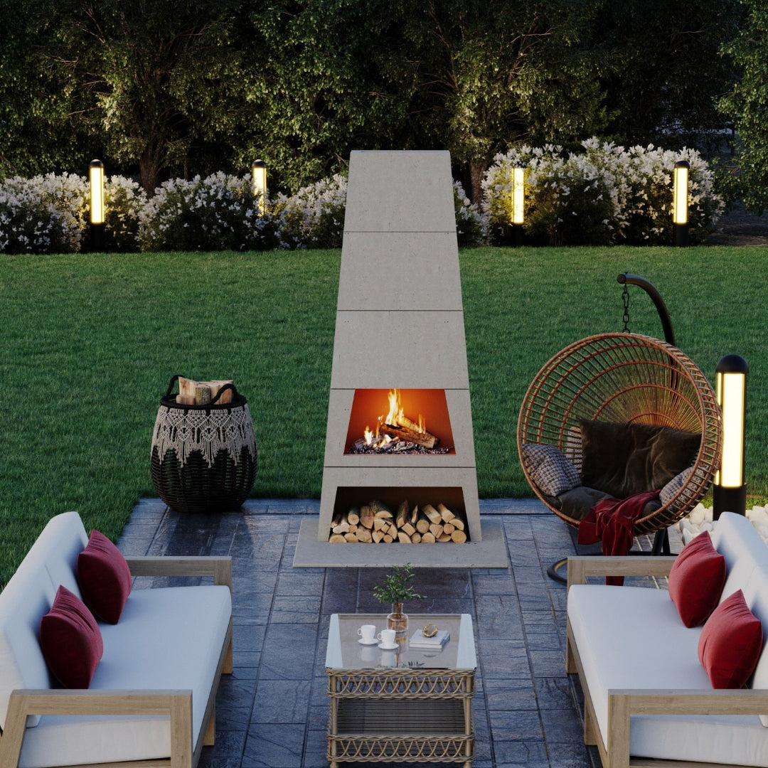 Kairo Outdoor Fireplace creating a striking focal point for a patio, surrounded by outdoor furniture.