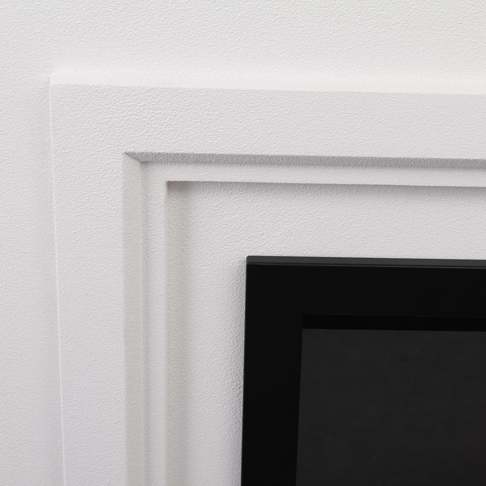 Close-up of the white trim framing the 33" firebox insert within the mantel.