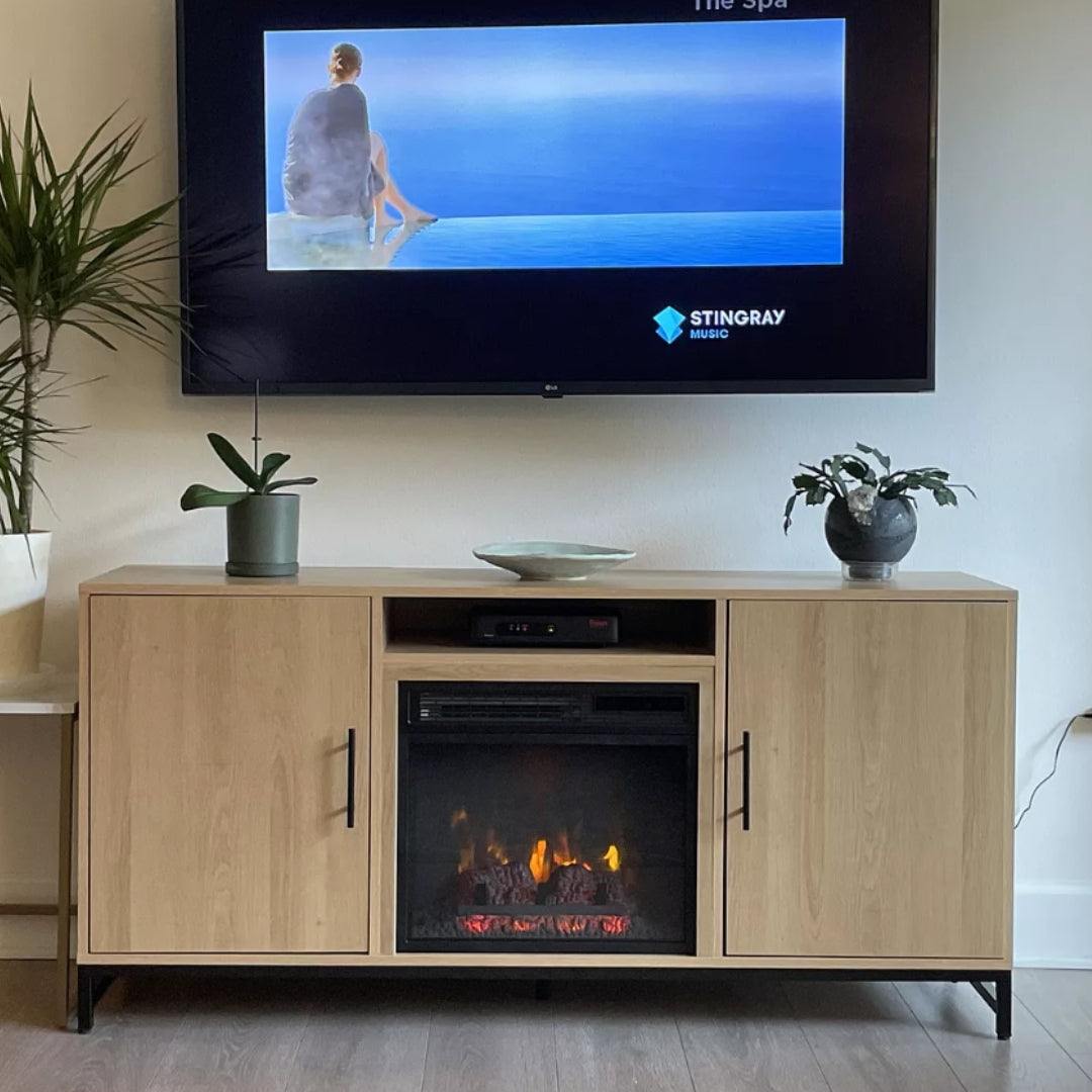 customer image Modern living room featuring natural oak fireplace media stand by Modern Ember with houseplants and mounted screen
