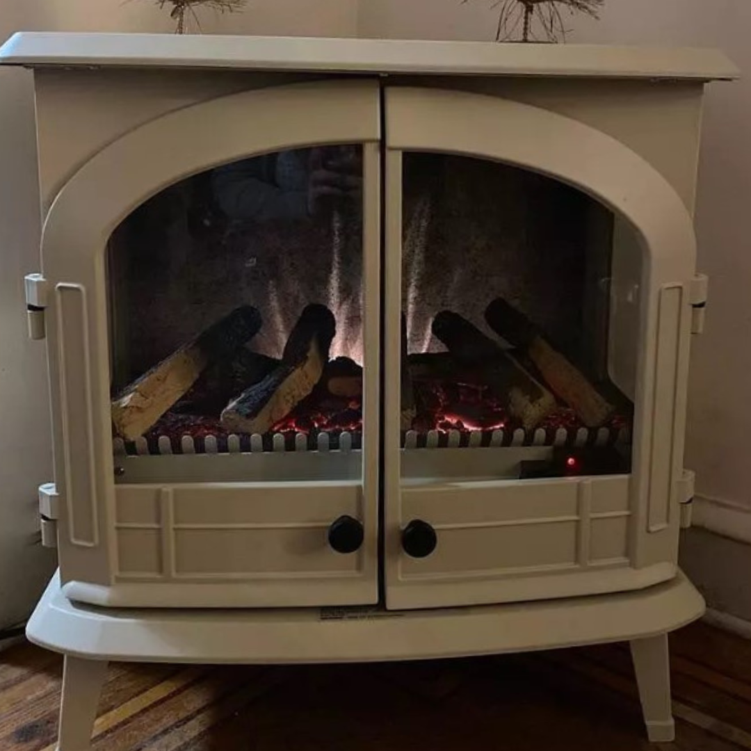 customer image of Vintage-inspired white electric fireplace stove with dual glass doors, realistic glowing log set, and curved detailing, perfect for adding cozy, cottage-style warmth to any room.