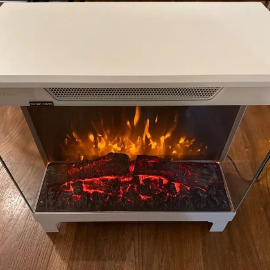 customer image of "Front-facing view of white Modern Ember electric fireplace with lifelike ember bed and glowing flame effect, set against hardwood flooring for a clean, modern home aesthetic
