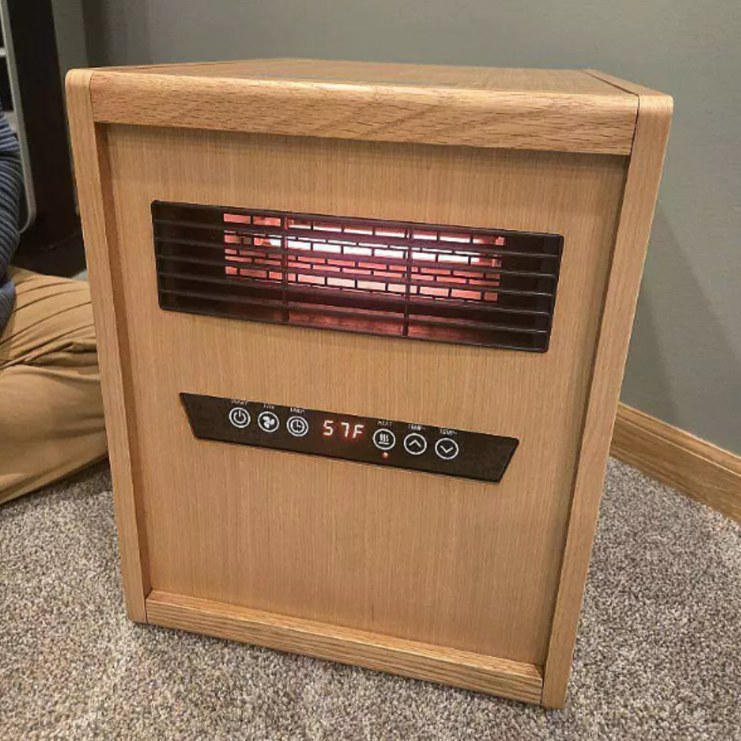 Compact wood-finish electric space heater with digital controls and infrared heating element, shown in a cozy carpeted room setting—combining warmth, style, and smart functionality