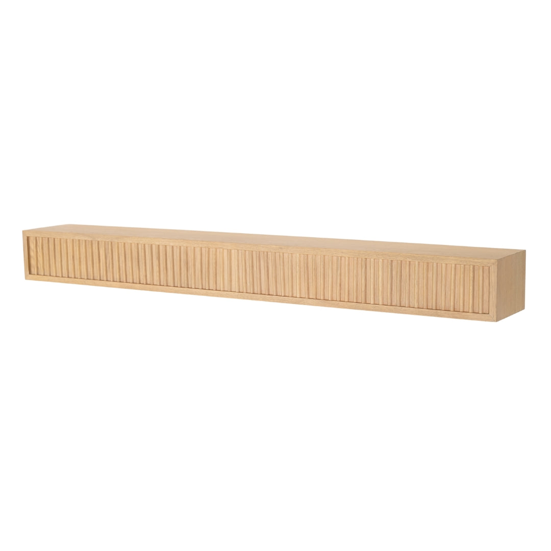 Angled view of the Blonde Monti Boxframe floating shelf, with clear fluted detailing for a dramatic modern look.