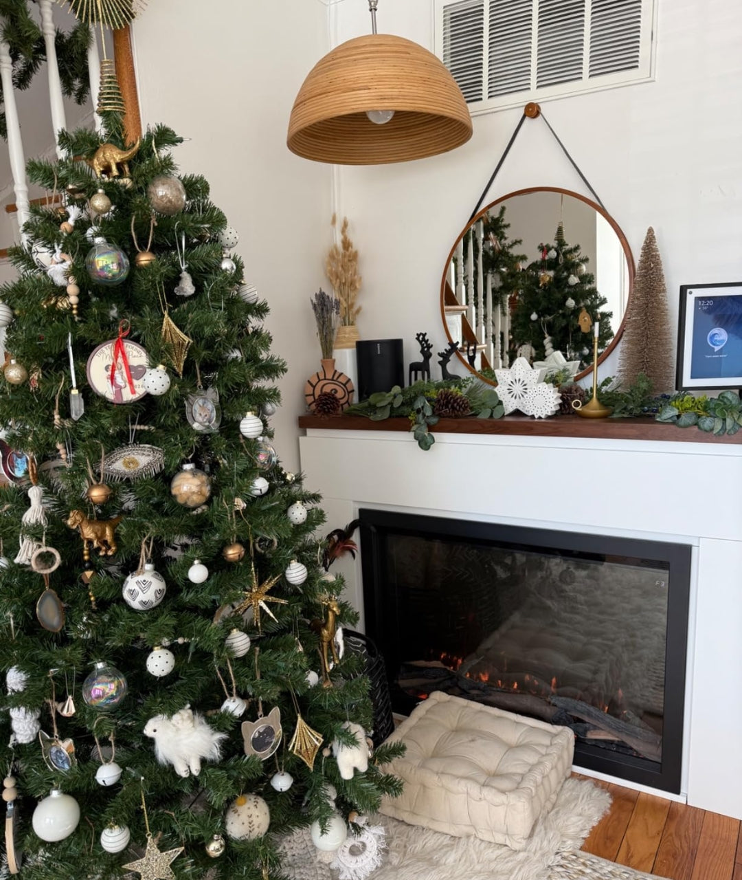 Customer image of electric fireplace with white mantel package and Christmas tree in living room.