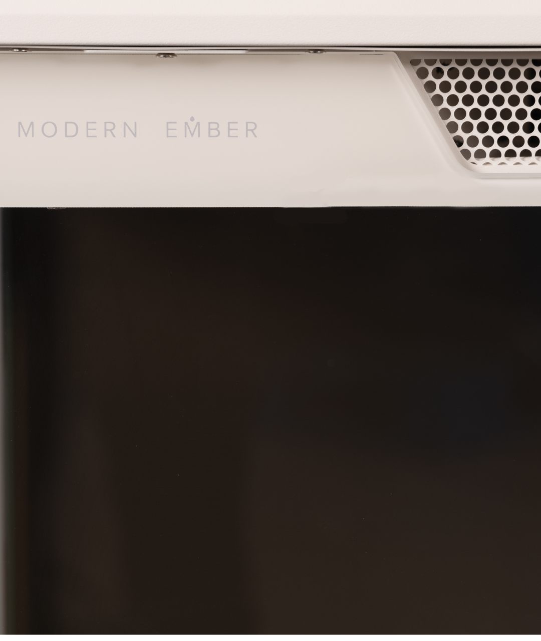 Close-up of Modern Ember electric fireplace with sleek glass panel and minimalist branding, showcasing premium craftsmanship, cool to touch glass, and modern design aesthetic
