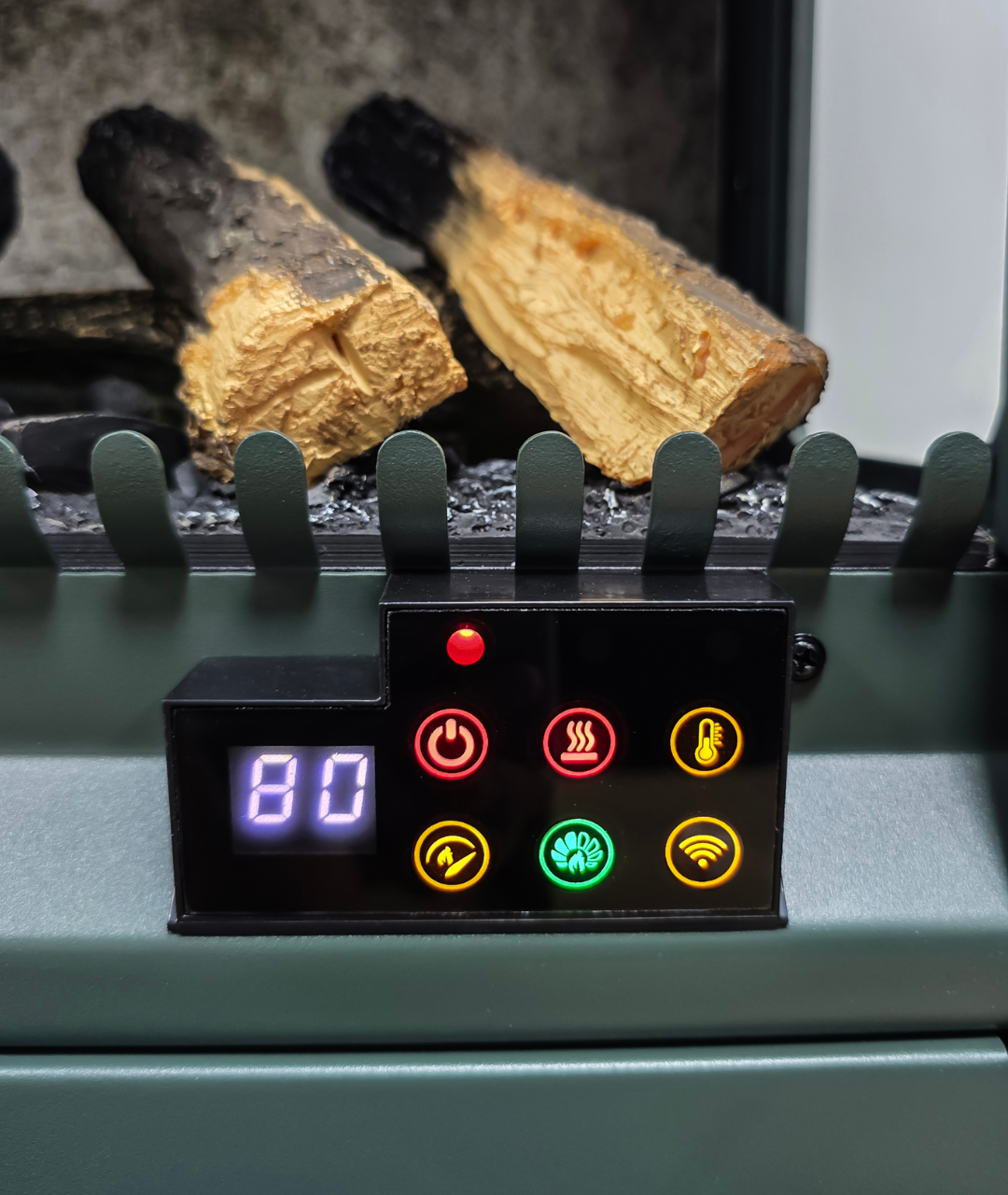 Close-up of freestanding electric wood stove and heater control panel with digital temperature display, smart settings, and realistic log insert, highlighting Modern Ember's advanced fireplace technology
