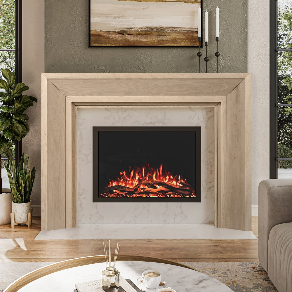 Everly Mantel Surround in unfinshed wood, installed around an electric fireplace, highlighting its clean lines and modern transitional style.