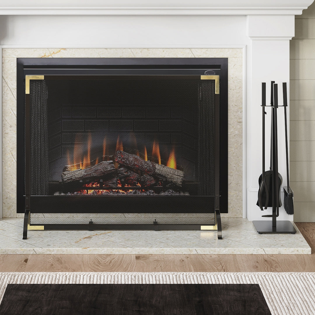Close up of electric fireplace insert with tools and screen in front.