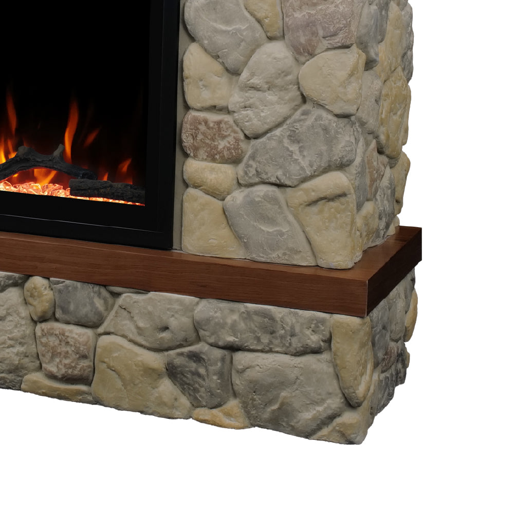 Detail shot of the Brookstone River Rock Mantel corner, showcasing natural stone craftsmanship and rustic appeal.