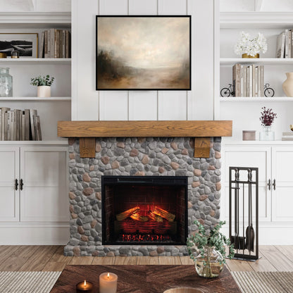 Close up of the Glenbrook River Rock Mantel with a white oak shelf and cast stone river rock surround, featuring a 28" smart electric firebox insert. Rustic farmhouse living room decor.