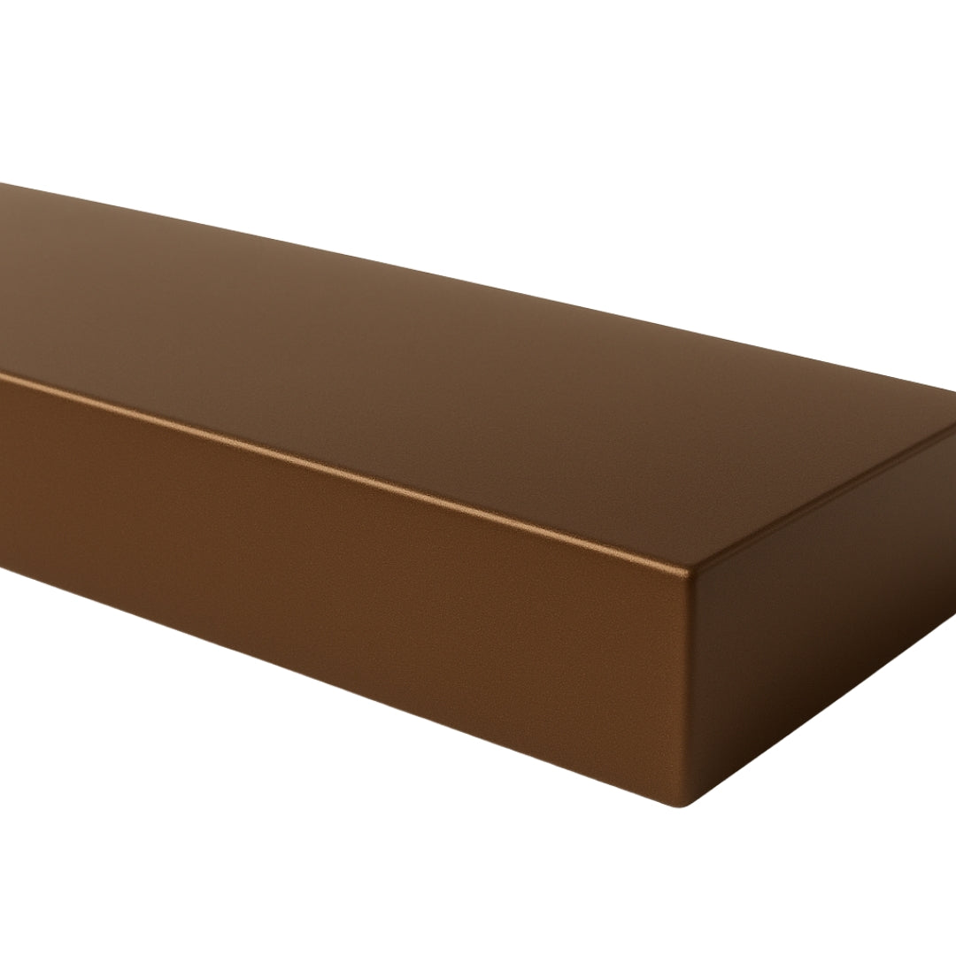 Close-up of a Lustra Metal floating shelf in a sleek cast bronze finish, highlighting the smooth, reflective texture and precise corners.
