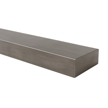 Angled view of the Lustra Metal floating shelf in a forged iron finish, emphasizing the clean, minimalist lines and light metallic tone.