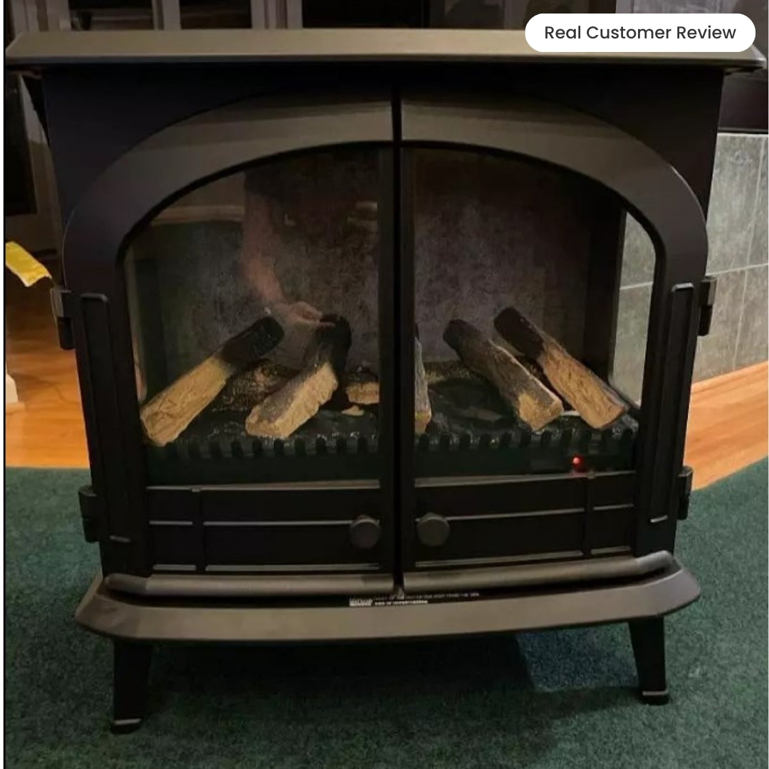 View inside the Harlowe electric stove with the doors closed, focusing on the curved glass window and the flickering fire effect.