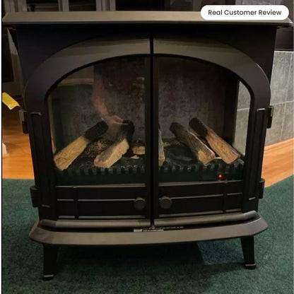 View inside the Harlowe electric stove with the doors closed, focusing on the curved glass window and the flickering fire effect.