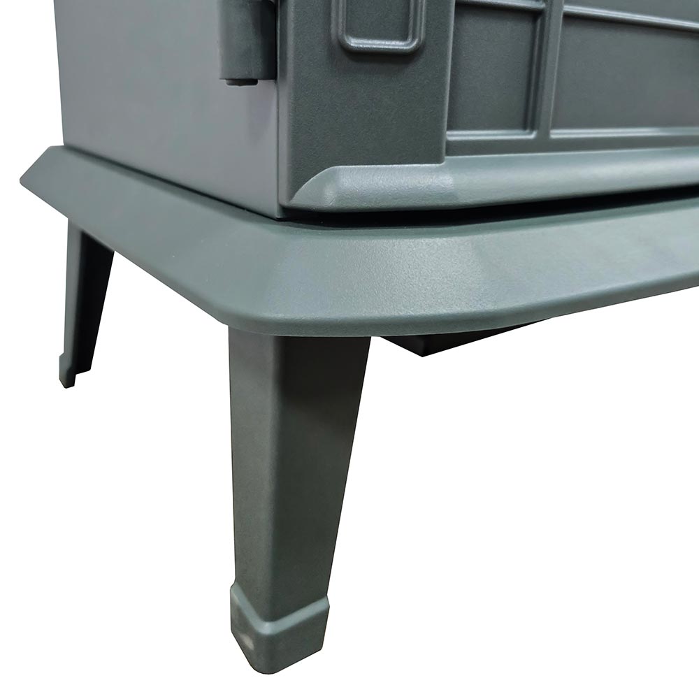 Close-up of the flared, hunter green metal legs of the Harlowe Freestanding Electric Stove, highlighting the traditional design.