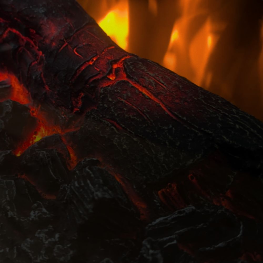 Close-up of the detailed faux log set inside the Skyline Freestanding Electric Stove, emphasizing realism.