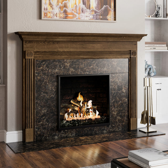Harriet Fireplace Tool Set in Aged Brass next to fireplace. 