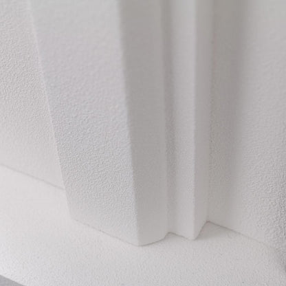 Close-up of the white premium cast stone mantel material, showing the fine stucco texture.