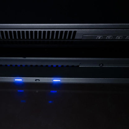 Close-up of the top interior of the 33" firebox insert, showing the downlight feature and heat vent.