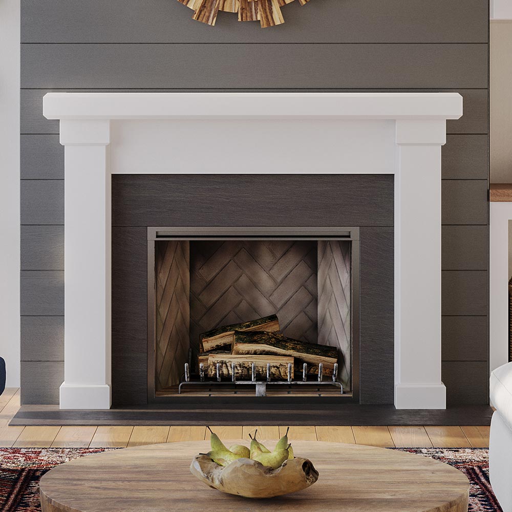 Modern Ember Nobel Mantel Surround in white finish framing black firebox with herringbone interior, styled in modern living room with wood accents.
