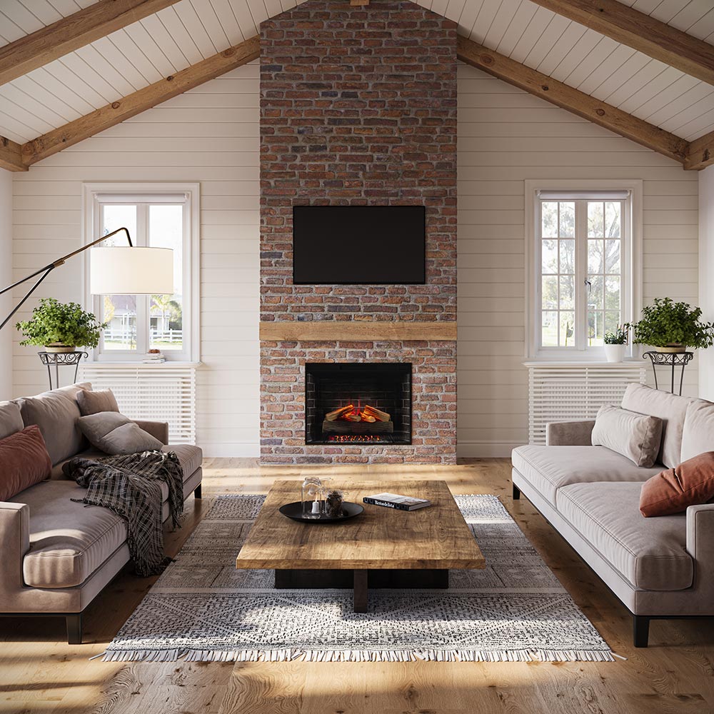 Living room with a brick fireplace with 33 inch uptown insert, gray sofas, and a wooden coffee table.