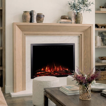 A modern electric fireplace insert with glowing orange and red flames, set within a light wood mantel in a styled living room.